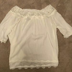 Off the shoulder white blouse.